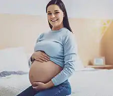schwangere frau bett